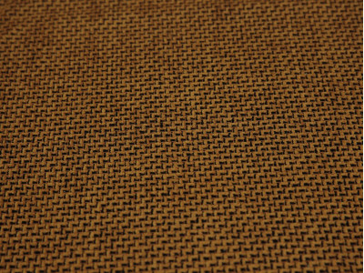 Костюмная ткань оранжевая с черным мелким принтом - фото